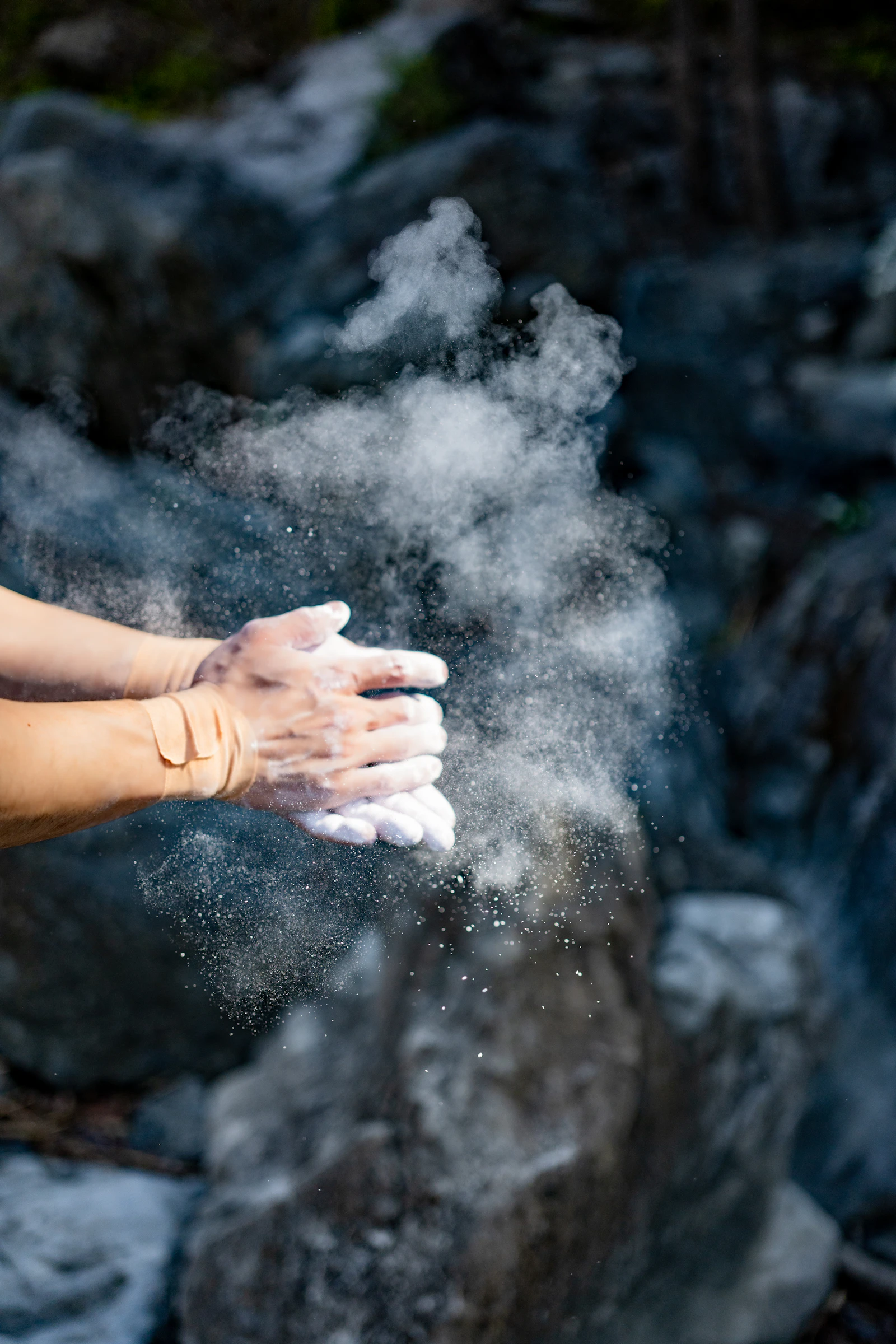 Chalked hands before a climb