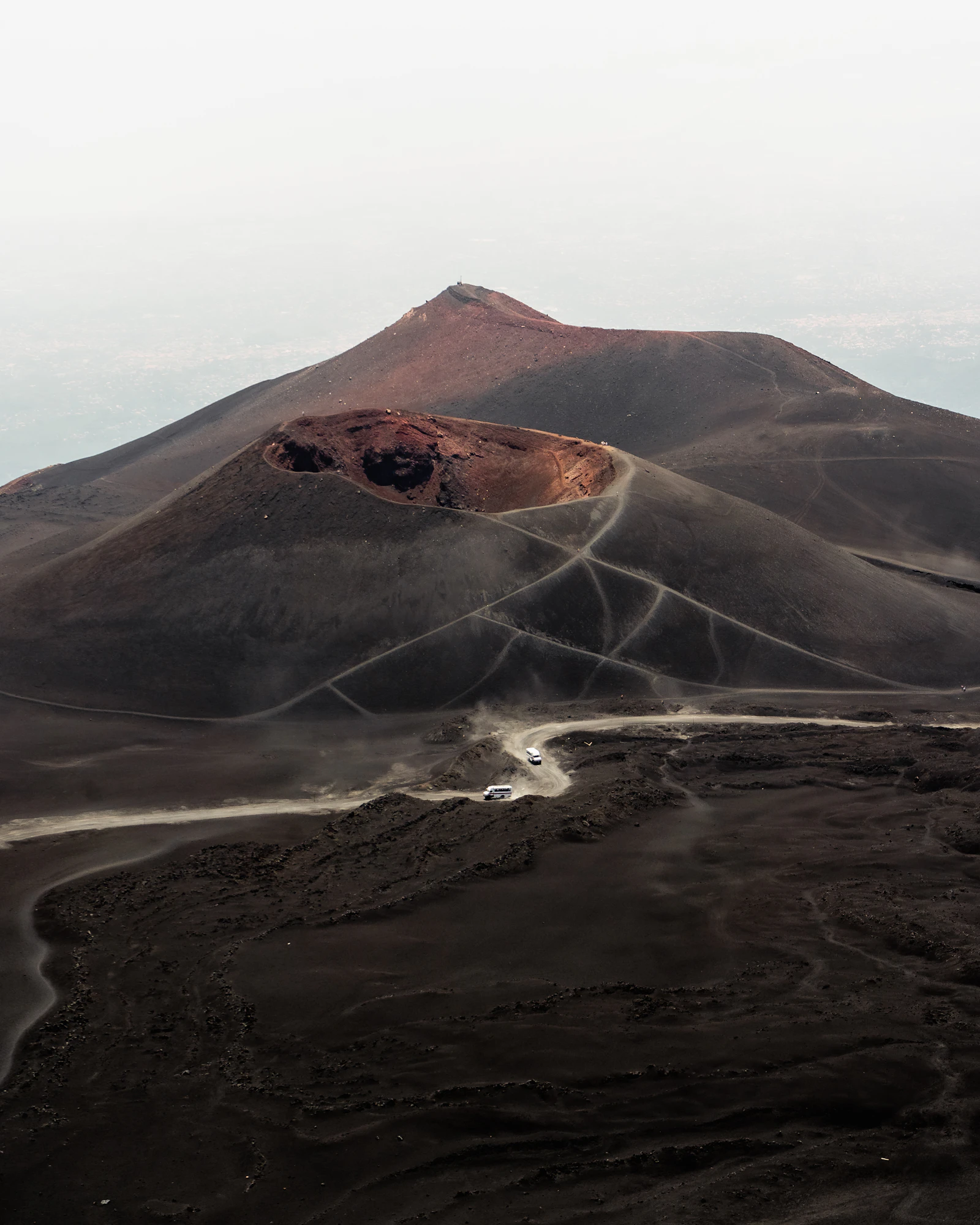 Trails winding across Etna’s craters and volcanic ground